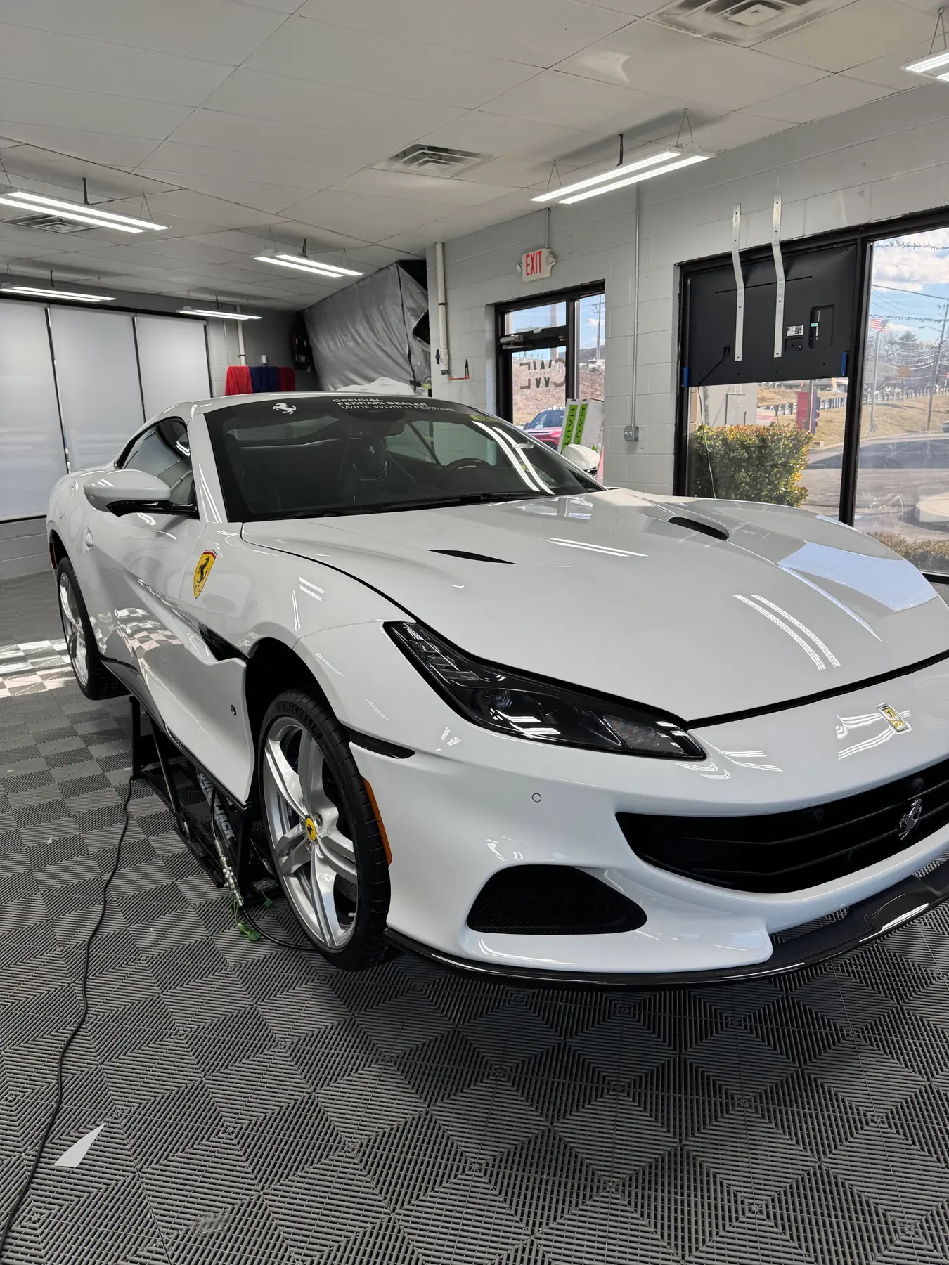 White Ferrari Portofino in the install bay
