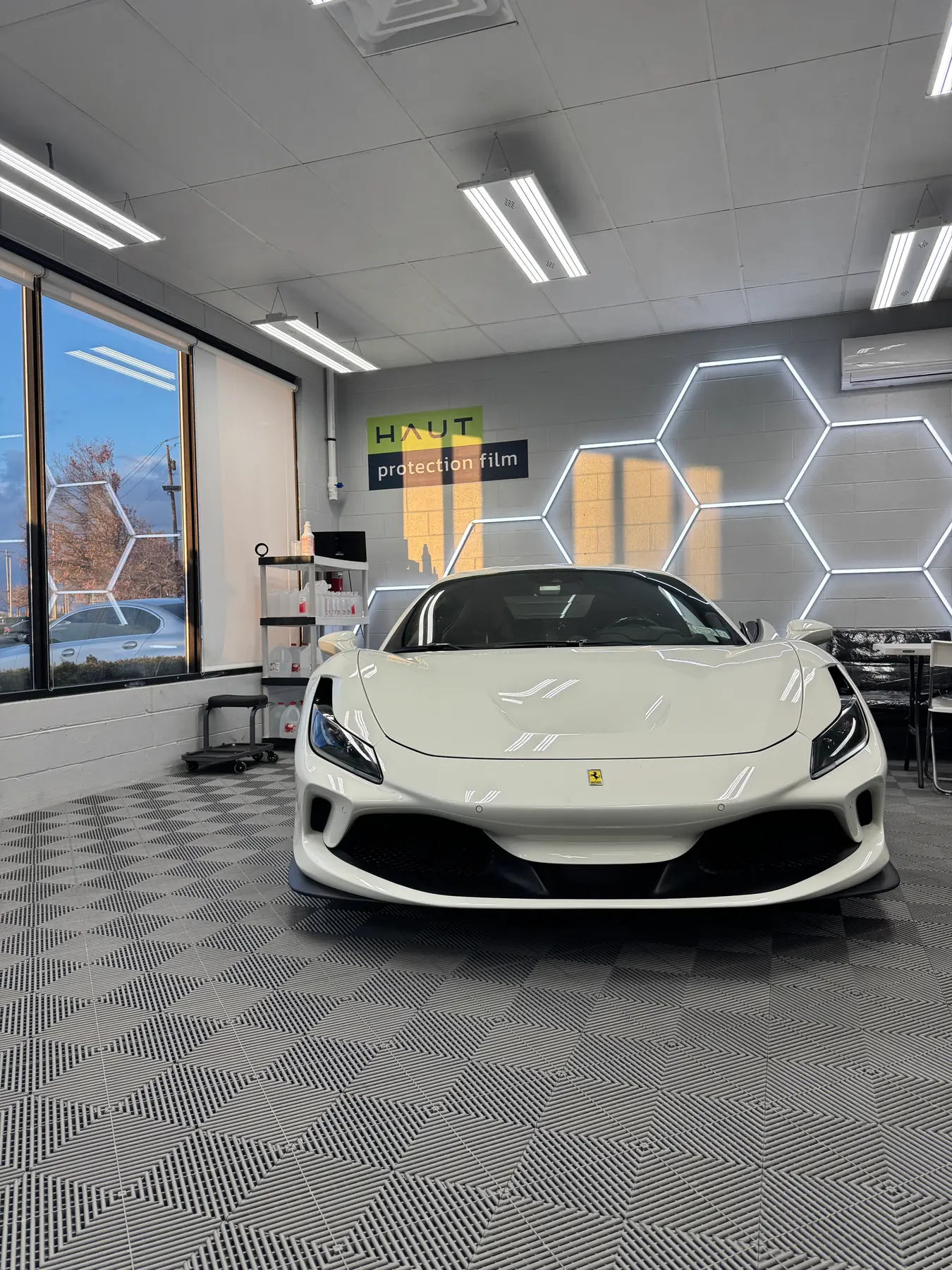 White Ferrari Roma in the install bay