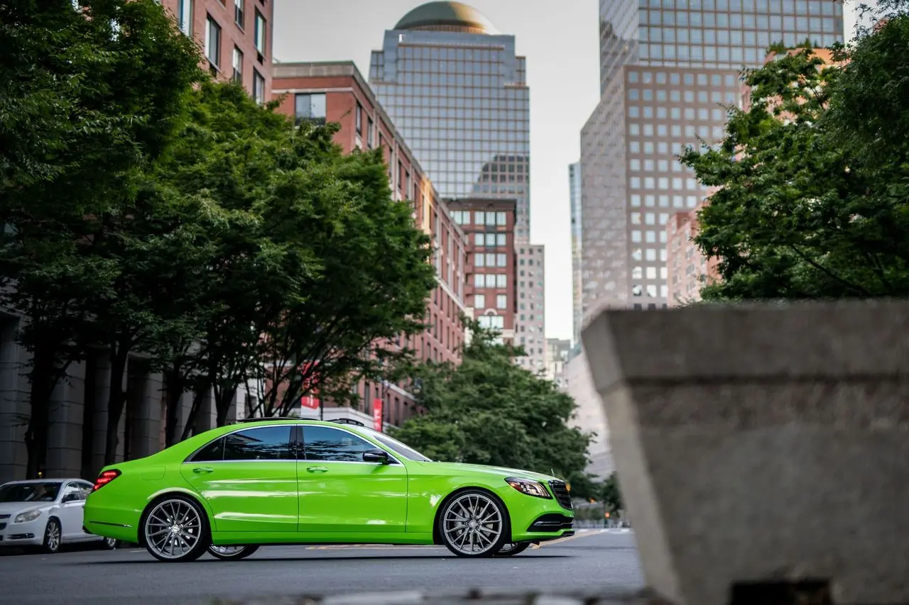 Lime green Mercedes-AMG sedan parked on a Manhattan street